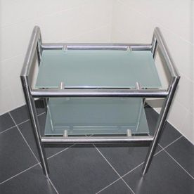 Glastisch mit Edelstahlrahmen